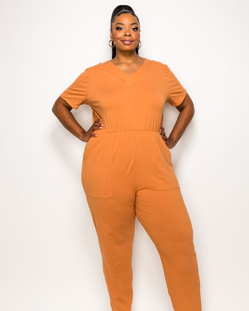 Front of a model wearing a plus size Kylie V Neck Jumpsuit in Clay by L I V D. | dia_product_style_image_id:241619